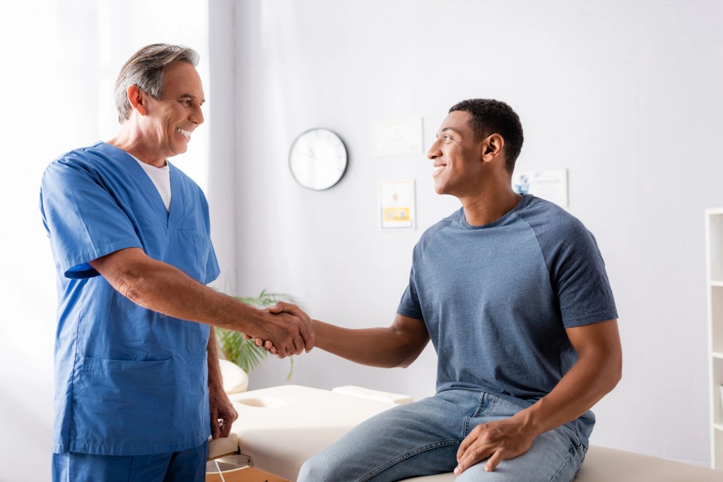 doctor discussing treatment options with male patient